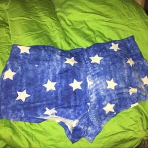 Very short blue shorts with white stars